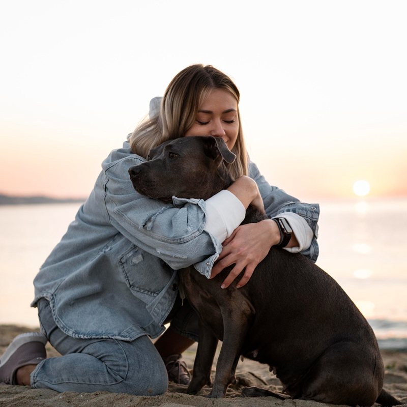 woman hugging a dog